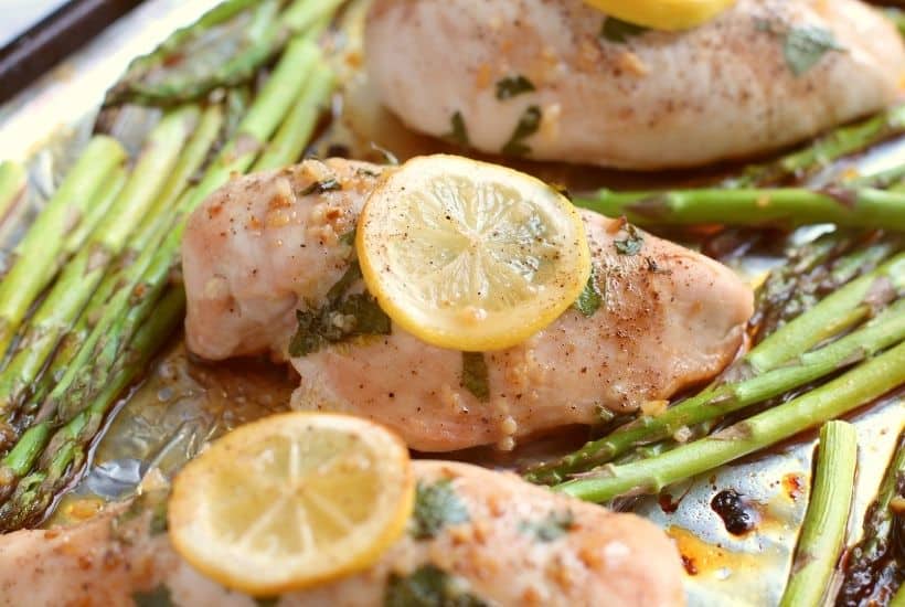 Simple and delicious is the perfect way to describe this easy Sheet Pan Honey Lemon Chicken & Asparagus recipe. This tasty chicken recipe is a simple and flavorful weeknight dinner. It's the perfect meal-in-one! This is an easy sheet pan recipe.
