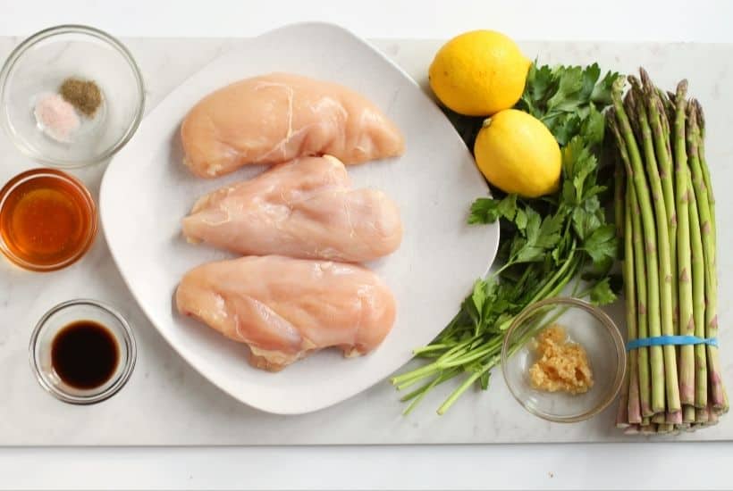Simple and delicious is the perfect way to describe this easy Sheet Pan Honey Lemon Chicken & Asparagus recipe. This tasty chicken recipe is a simple and flavorful weeknight dinner. It's the perfect meal-in-one! This is an easy sheet pan recipe.