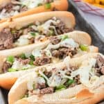 Enjoy the fresh flavor of a thinly sliced steak with cheese, onions, and peppers on rolls with this recipe for homemade Philly Cheesesteaks. If you’ve ever visited Philly (or any of the towns surrounding Philadelphia), you know that they are best known for the famous Philly Cheesesteak. This easy cheesesteak recipe is great to have for lunch and dinner.