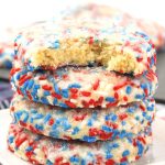 There is no better way to celebrate a day like July 4th than with some homemade red, white, and blue Patriotic Butter Cookies. Try this recipe for some of the tastiest, most flavorful baked cookies ever! This easy red, white and blue recipe is a delicious 4th of July Recipe. This classic butter cookie recipe is rolled in red, white and blue patriotic sprinkles.