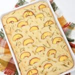 Prepare a light and refreshing treat with this delicious Peach & Rosemary Focaccia Bread. It has the perfect naturally sweet touch with peaches, making it the perfect quick snack to enjoy! Focaccia bread, the Italian-style bread. With this recipe for Peach & Rosemary Focaccia Bread, you’re combining two incredible flavors into one to make bread that has a light, sweet taste and amazing texture that keeps you coming back for more.