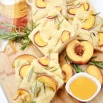 Prepare a light and refreshing treat with this delicious Peach & Rosemary Focaccia Bread. It has the perfect naturally sweet touch with peaches, making it the perfect quick snack to enjoy! Focaccia bread, the Italian-style bread. With this recipe for Peach & Rosemary Focaccia Bread, you’re combining two incredible flavors into one to make bread that has a light, sweet taste and amazing texture that keeps you coming back for more.