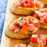 Bruschetta is a classic Italian appetizer that is easy to make at home. Toasted bread is topped with tomatoes, Parmesan cheese, garlic, and fresh basil. If you're looking for something different to serve your guests, consider this Italian classic: Bruschetta. This dish is simple to make and can be tailored to your guests' tastes. This appetizer is nice because it can serve many people and is super inexpensive to make!