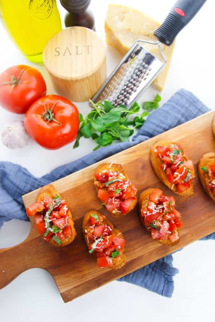 Bruschetta is a classic Italian appetizer that is easy to make at home. Toasted bread is topped with tomatoes, Parmesan cheese, garlic, and fresh basil. If you're looking for something different to serve your guests, consider this Italian classic: Bruschetta. This dish is simple to make and can be tailored to your guests' tastes. This appetizer is nice because it can serve many people and is super inexpensive to make!