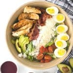 Delicious, light and flavorful is the way to go with this Grilled Chicken Cobb Salad recipe. This easy meal idea is great to take with you when you’re on the go, whether you’re headed to work or traveling. This salad is portable too! This is a great mason jar recipe to take to work or serve at a picnic. Summertime is the perfect time to enjoy salads. This Grilled Chicken Cobb Salad is delicious in so many ways, go ahead and give it a try!