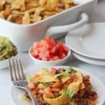 Looking for a simple easy weeknight dinner that the entire family can enjoy? You'll want to grab a bag of Fritos and try this easy and delicious Walking Taco Casserole!