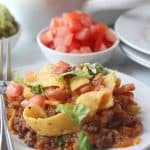 Looking for a simple easy weeknight dinner that the entire family can enjoy? You'll want to grab a bag of Fritos and try this easy and delicious Walking Taco Casserole!