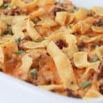 Looking for a simple easy weeknight dinner that the entire family can enjoy? You'll want to grab a bag of Fritos and try this easy and delicious Walking Taco Casserole!