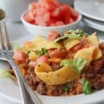 Looking for a simple easy weeknight dinner that the entire family can enjoy? You'll want to grab a bag of Fritos and try this easy and delicious Walking Taco Casserole!