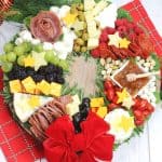 Charcuterie boards are a great party appetizer idea, especially during the holiday season. This festive, and delicious Christmas Wreath Charcuterie Board will wow your guests for the holidays.