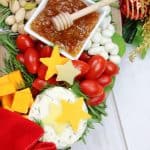 Charcuterie boards are a great party appetizer idea, especially during the holiday season. This festive, and delicious Christmas Wreath Charcuterie Board will wow your guests for the holidays.