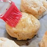 When craving light and fluffy biscuits, give this Honey Butter Biscuits recipe a try. They have the perfect taste and texture, pairing perfectly with all kinds of flavorful meals. These soft and flaky buttermilk biscuits are brushed with homemade honey butter.