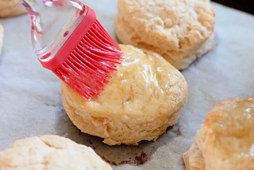 When craving light and fluffy biscuits, give this Honey Butter Biscuits recipe a try. They have the perfect taste and texture, pairing perfectly with all kinds of flavorful meals. These soft and flaky buttermilk biscuits are brushed with homemade honey butter.