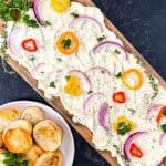 Butter boards are a new rage. You simply spread butter on a board and from there, you can add flavorings, seasonings, or dip whatever you'd like into the butter. You've heard of the charcuterie board, but this butter board is changing the appetizer scene. Learn how to make a butter board.