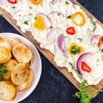 Butter boards are a new rage. You simply spread butter on a board and from there, you can add flavorings, seasonings, or dip whatever you'd like into the butter. You've heard of the charcuterie board, but this butter board is changing the appetizer scene. Learn how to make a butter board.