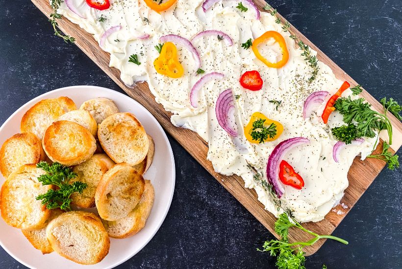 Butter boards are a new rage. You simply spread butter on a board and from there, you can add flavorings, seasonings, or dip whatever you'd like into the butter. You've heard of the charcuterie board, but this butter board is changing the appetizer scene. Learn how to make a butter board.