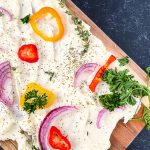 Butter boards are a new rage. You simply spread butter on a board and from there, you can add flavorings, seasonings, or dip whatever you'd like into the butter. You've heard of the charcuterie board, but this butter board is changing the appetizer scene. Learn how to make a butter board.