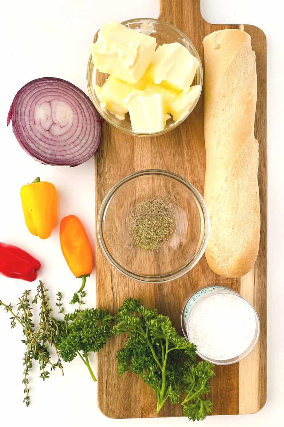 Butter boards are a new rage. You simply spread butter on a board and from there, you can add flavorings, seasonings, or dip whatever you'd like into the butter. You've heard of the charcuterie board, but this butter board is changing the appetizer scene. Learn how to make a butter board.
