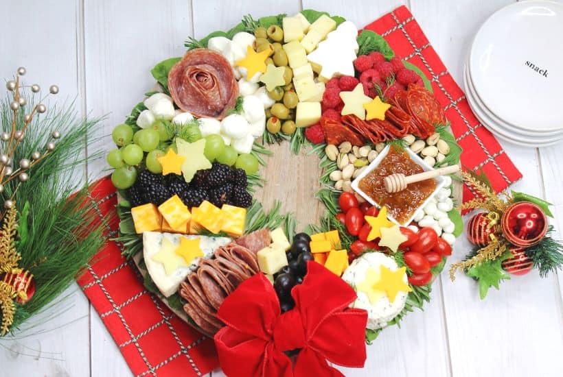 Charcuterie boards are a great party appetizer idea, especially during the holiday season. This festive, and delicious Christmas Wreath Charcuterie Board will wow your guests for the holidays.