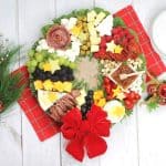 Charcuterie boards are a great party appetizer idea, especially during the holiday season. This festive, and delicious Christmas Wreath Charcuterie Board will wow your guests for the holidays.