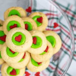Grinch Thumbprints. The Grinch may be a mean one, but you don’t have to be when serving up these tasty Grinch Thumbprints. These sweet and easy thumbprint cookies look as good as they taste and will be a huge hit this holiday! This is an easy Christmas cookie recipe to enjoy with family or make for a Christmas Cookie Exchange.