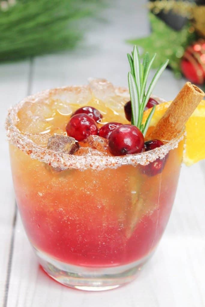 Craving a tasty pick-me-up to enjoy this holiday season? Look no further than the Naughty and Nice Cocktail. This Christmas cocktail recipe is a perfect blend of cranberry, orange, and grapefruit juices with whiskey and more!