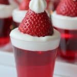 Bring in the celebration during the holiday season with these Santa Hat Jello Shots. This fun Christmas Jello Shot recipe tastes absolutely amazing! This easy jello shot recipe is a perfect holiday party recipe idea.