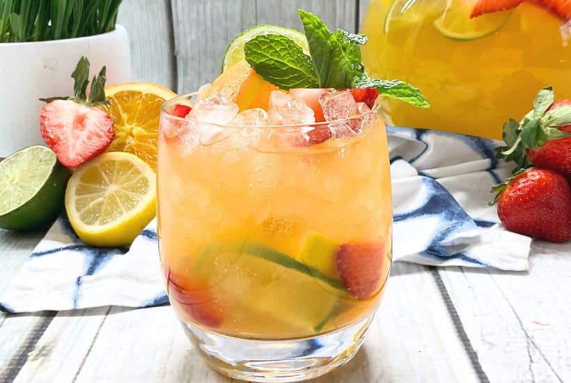 Who says you need to visit the bar for fresh, flavorful adult-friendly beverages? Learn how to easily prepare an incredible White Wine Sangria in no time with this simple, stress-free recipe. This is an easy summer drink recipe.