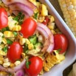 Ditch the typical pasta salad and go for something lighter and refreshing with this delicious grilled Corn Tomato Salad recipe. It’s the perfect summer side to serve. This easy summer salad pairs two stars of the season - corn and tomatoes, making this healthy salad recipe a winner.