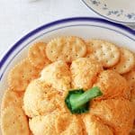 Prepare the perfect fall appetizer for family and friends with this Pumpkin Shaped Cheeseball. It looks just as good as it tastes and is the ideal addition to your fall party menu. Dip some of your favorite foods into it to add that extra cheesy touch!