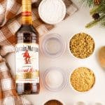 This easy rum balls recipe is part nostalgia and part holiday tradition. These rum balls are a blend of liquor, chocolate, walnuts and cookies, rolled together and coated in powdered sugar or cocoa. This easy no-bake recipe is a must for the holidays.