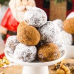 This easy rum balls recipe is part nostalgia and part holiday tradition. These rum balls are a blend of liquor, chocolate, walnuts and cookies, rolled together and coated in powdered sugar or cocoa. This easy no-bake recipe is a must for the holidays.