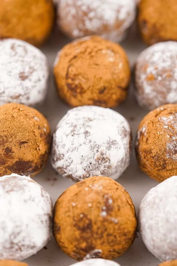 This easy rum balls recipe is part nostalgia and part holiday tradition. These rum balls are a blend of liquor, chocolate, walnuts and cookies, rolled together and coated in powdered sugar or cocoa. This easy no-bake recipe is a must for the holidays.
