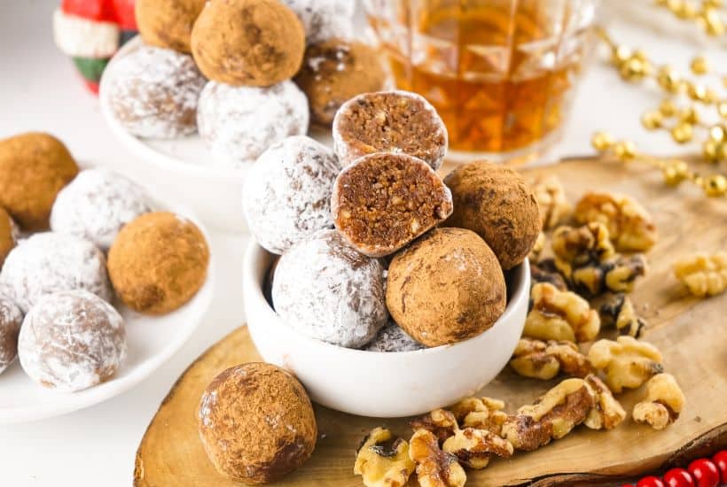 This easy rum balls recipe is part nostalgia and part holiday tradition. These rum balls are a blend of liquor, chocolate, walnuts and cookies, rolled together and coated in powdered sugar or cocoa. This easy no-bake recipe is a must for the holidays.