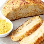 If you're anything like me, cheese and bread are two of your favorite things. But what if I told you it's possible to combine the two to make something incredible? With just five simple ingredients, this recipe for Artisan No-Knead Cheddar Bread proves that you certainly can have the best of both worlds!