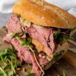 This Roast Beef Sandwich is no ordinary sandwich! With medium-rare roast beef, arugula, shaved parmesan, and roasted pine nuts, this roast beef sandwich is over-the-top delicious. And when you slather on that homemade truffle mayo it becomes absolute perfection.