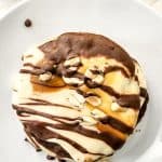 These Soft & Chewy Snickers Cookies are a delightful treat that has all the flavors of a Snickers bar. The double chocolate cookies are soft and chewy while the nougat whipped frosting adds a totally different chewy element. Topped with melted caramel, chocolate, and peanuts, these Snickers cookies truly are the perfect sweet treat.