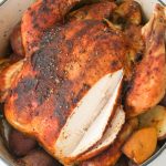 This Dutch Oven Roasted Chicken is the ultimate one-pot meal! Juicy chicken with a crispy golden brown skin is roasted to perfection with lemon and garlic, along with potatoes that soak up all the delicious flavors.
