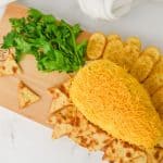 Get ready to wow your guests this Easter with the most adorable and delicious carrot-shaped Easter Cheese Ball! This whimsical Carrot Cheeseball appetizer is sure to steal the show with its festive carrot shape and irresistible flavors. Learn how to turn a simple cheese ball recipe into a great make-ahead appetizer for your Easter Dinner.