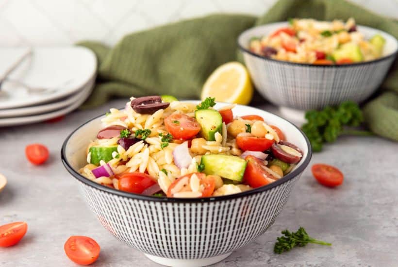 When it comes to side dishes, this simple Greek Orzo Salad is one of my family's favorite recipes. No cookout is complete without this healthy pasta salad recipe full of Greek flavor.