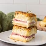 These Ham and Cheese Hawaiian Sliders are the ultimate party appetizers! Sweet Hawaiian rolls packed with savory ham, melty Swiss cheese, and a deliciously sweet and tangy glaze. This classic recipe is a family favorite.