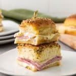 These Ham and Cheese Hawaiian Sliders are the ultimate party appetizers! Sweet Hawaiian rolls packed with savory ham, melty Swiss cheese, and a deliciously sweet and tangy glaze. This classic recipe is a family favorite.