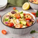 When it comes to side dishes, this simple Greek Orzo Salad is one of my family's favorite recipes. No cookout is complete without this healthy pasta salad recipe full of Greek flavor.