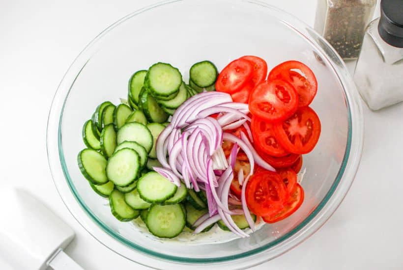 If you're in the mood for a light and refreshing side dish, this Creamy Tomato and Cucumber Salad is just what you need. It's a simple combination of sliced tomatoes, cucumbers, and red onion, all tossed in a creamy, tangy dressing.