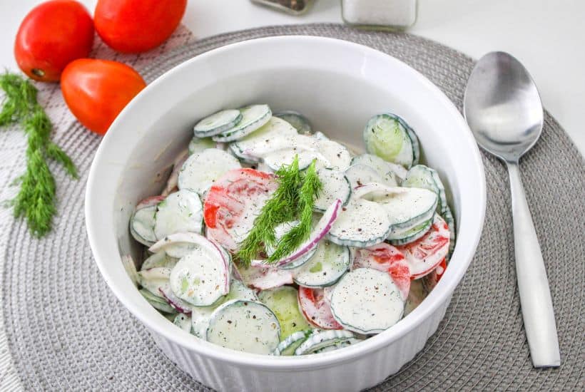 If you're in the mood for a light and refreshing side dish, this Creamy Tomato and Cucumber Salad is just what you need. It's a simple combination of sliced tomatoes, cucumbers, and red onion, all tossed in a creamy, tangy dressing.