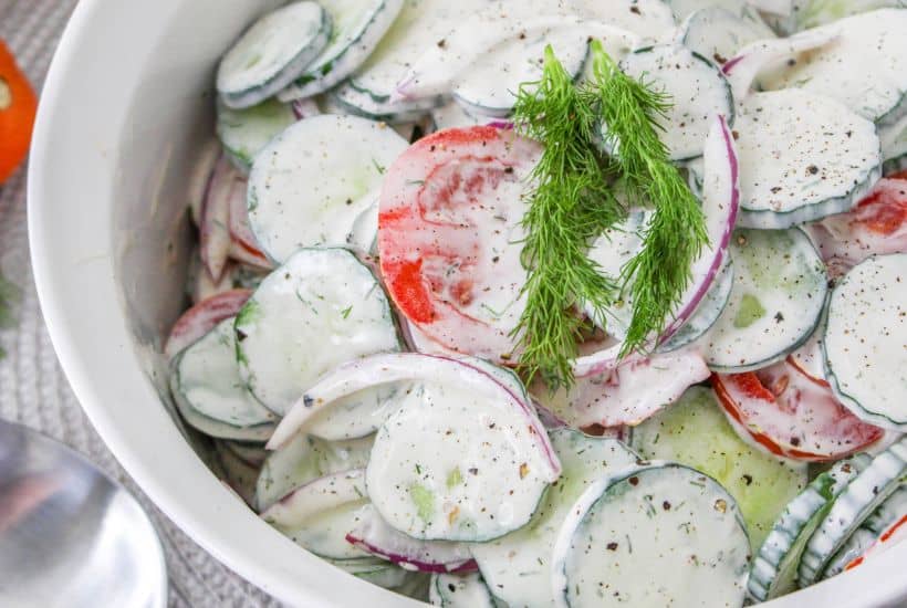 If you're in the mood for a light and refreshing side dish, this Creamy Tomato and Cucumber Salad is just what you need. It's a simple combination of sliced tomatoes, cucumbers, and red onion, all tossed in a creamy, tangy dressing.