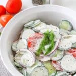 If you're in the mood for a light and refreshing side dish, this Creamy Tomato and Cucumber Salad is just what you need. It's a simple combination of sliced tomatoes, cucumbers, and red onion, all tossed in a creamy, tangy dressing.