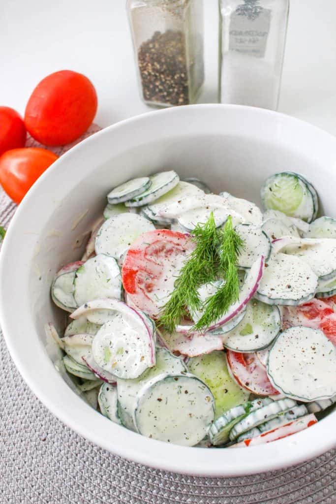If you're in the mood for a light and refreshing side dish, this Creamy Tomato and Cucumber Salad is just what you need. It's a simple combination of sliced tomatoes, cucumbers, and red onion, all tossed in a creamy, tangy dressing.