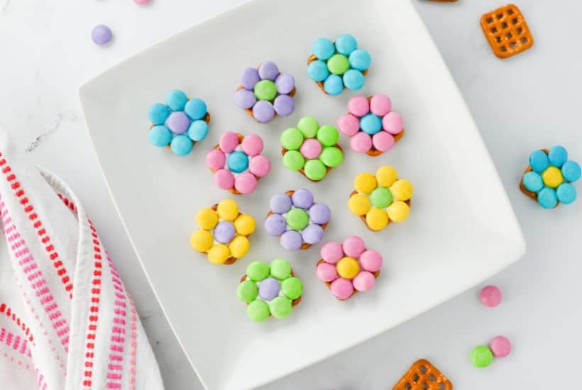 If you're looking for an easy springtime treat, you’re going to love these Pretzel Flowers with M&Ms! This recipe effortlessly blends the salty crunch of butter snap pretzels with pastel Easter M&Ms and white chocolate to make an adorable sweet treat.