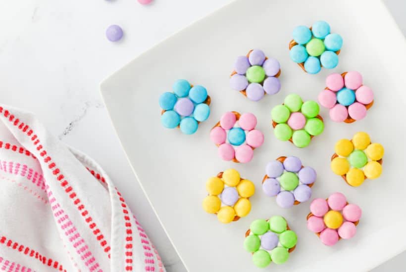 If you're looking for an easy springtime treat, you’re going to love these Pretzel Flowers with M&Ms! This recipe effortlessly blends the salty crunch of butter snap pretzels with pastel Easter M&Ms and white chocolate to make an adorable sweet treat.